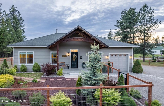 684 Chute Canyon Way, Bonners Ferry, ID 83805 - view of front of house featuring a garage, driveway, and roof with shingles