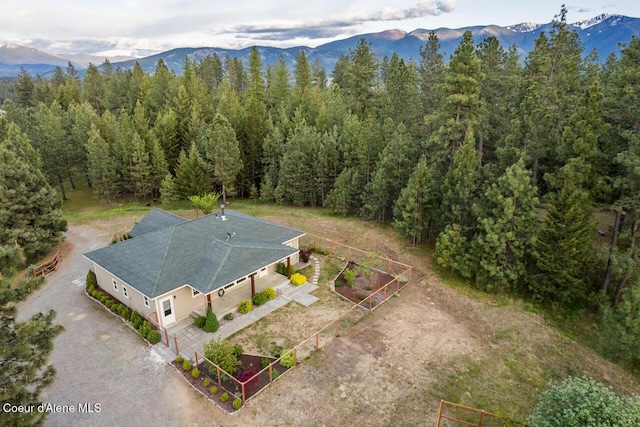 684 Chute Canyon Way, Bonners Ferry, ID 83805 - aerial view of property and surrounding area with a mountainous background and a heavily wooded area