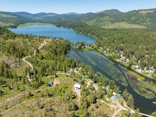7547 W Channel Ln, Rathdrum, ID 83858 - aerial overview of property's location featuring a forest and a water and mountain view
