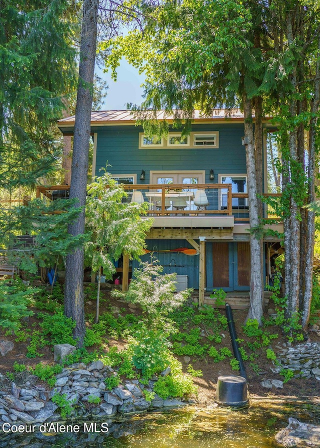 7547 W Channel Ln, Rathdrum, ID 83858 - rear view of house featuring a deck