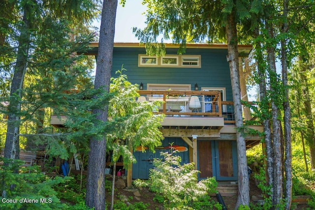 7547 W Channel Ln, Rathdrum, ID 83858 - rear view of property with a balcony