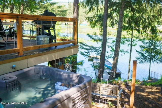 7547 W Channel Ln, Rathdrum, ID 83858 - exterior space featuring a hot tub and a water view