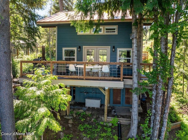7547 W Channel Ln, Rathdrum, ID 83858 - rear view of property featuring metal roof and a deck