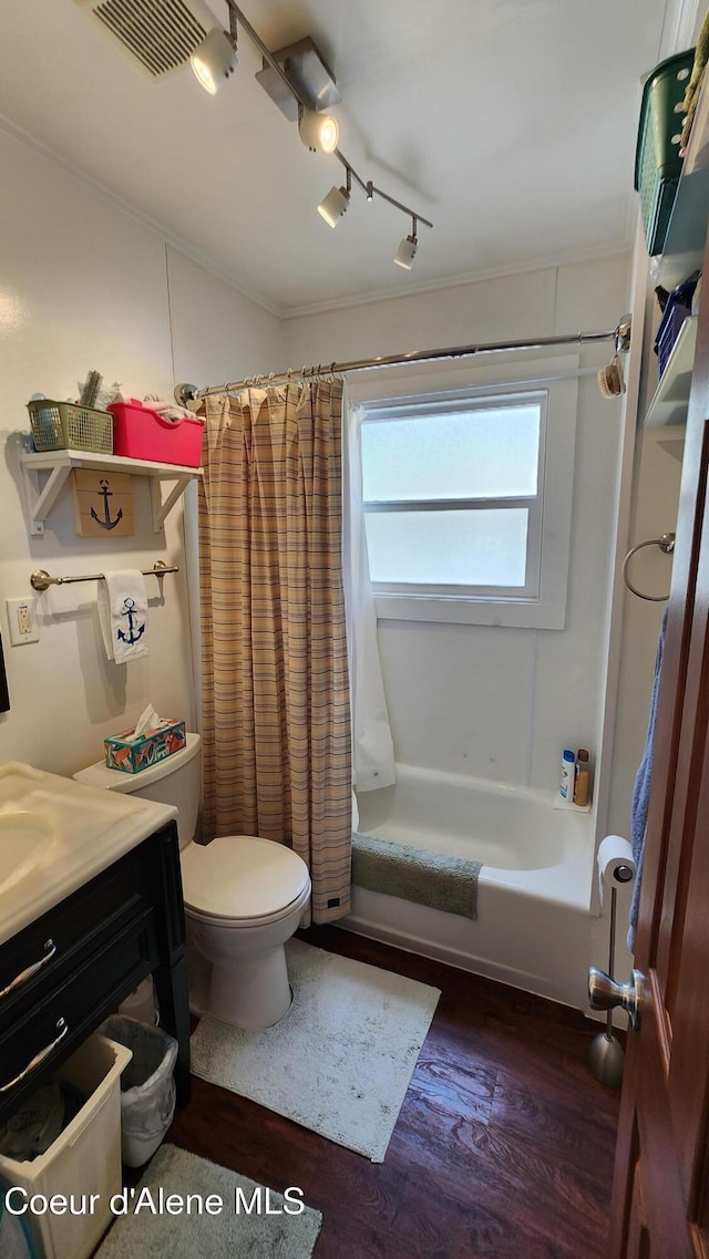 16646 E Cape Horn Rd, Bayview, ID 83803 - bathroom with shower / bath combination with curtain, toilet, vanity, wood finished floors, and rail lighting