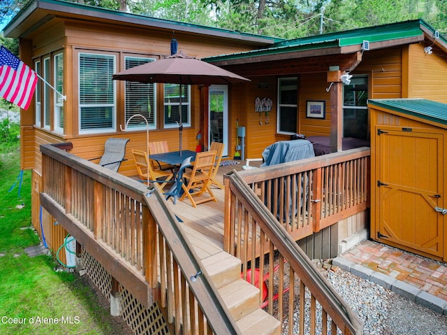 16646 E Cape Horn Rd, Bayview, ID 83803 - wooden deck featuring stairs and outdoor dining area