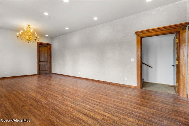 5239 E Dodd Rd, Hayden, ID 83835 - empty room featuring wood finished floors, a chandelier, recessed lighting, and baseboards