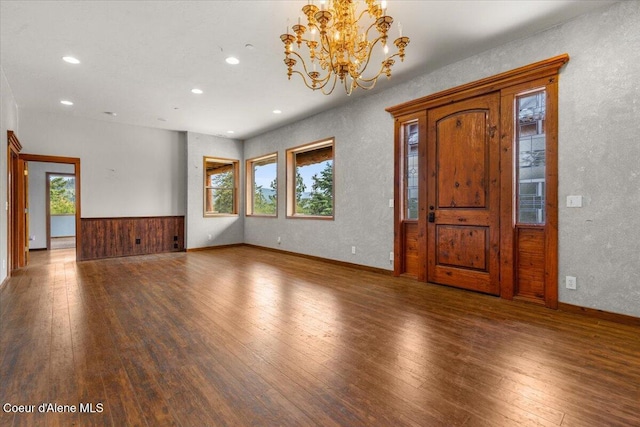 5239 E Dodd Rd, Hayden, ID 83835 - foyer featuring wood-type flooring, a chandelier, recessed lighting, wainscoting, and baseboards