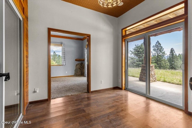 5239 E Dodd Rd, Hayden, ID 83835 - empty room featuring healthy amount of natural light, wood finished floors, and baseboards