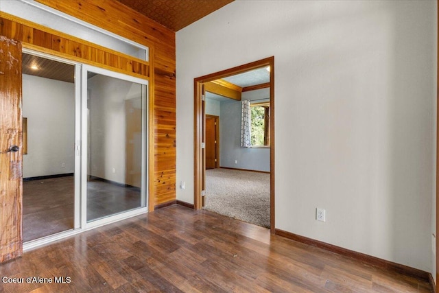 5239 E Dodd Rd, Hayden, ID 83835 - spare room featuring wood finished floors, baseboards, and wooden walls
