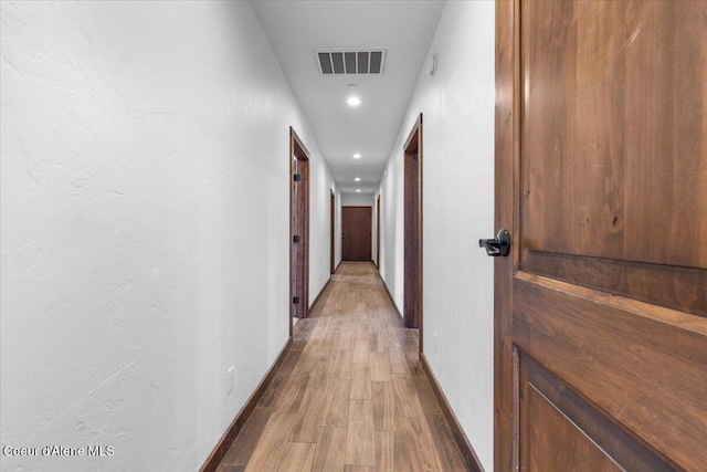 5239 E Dodd Rd, Hayden, ID 83835 - hall featuring wood finished floors, baseboards, and recessed lighting