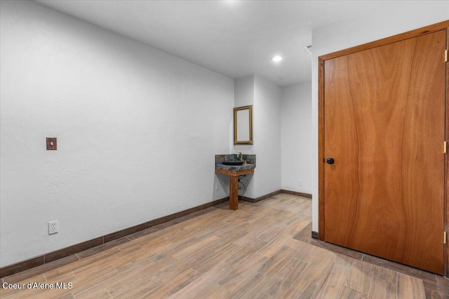 5239 E Dodd Rd, Hayden, ID 83835 - spare room with wood finished floors, baseboards, and recessed lighting