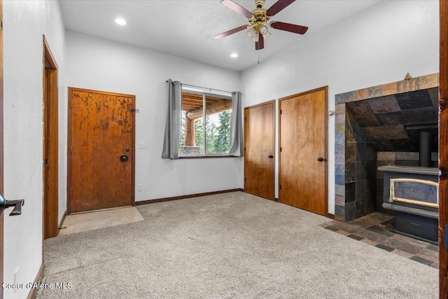 5239 E Dodd Rd, Hayden, ID 83835 - unfurnished bedroom with a wood stove, carpet floors, multiple closets, recessed lighting, and baseboards