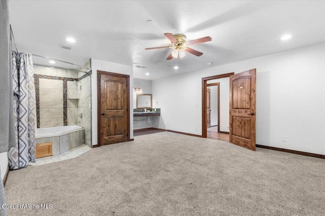 5239 E Dodd Rd, Hayden, ID 83835 - unfurnished bedroom featuring carpet floors, recessed lighting, ensuite bathroom, baseboards, and a ceiling fan