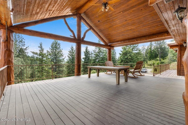 5239 E Dodd Rd, Hayden, ID 83835 - wooden deck with view of wooded area and outdoor dining space
