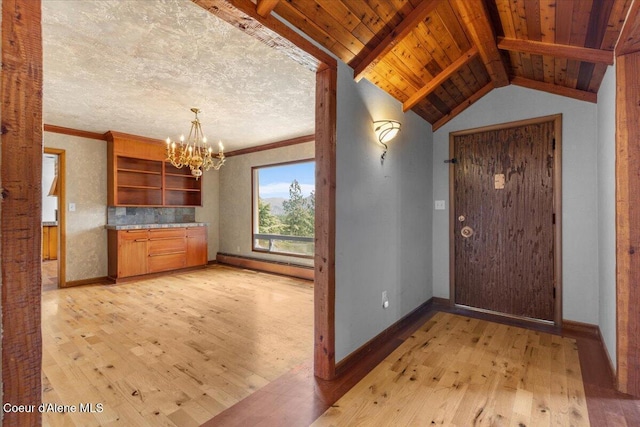 5239 E Dodd Rd, Hayden, ID 83835 - entrance foyer with a baseboard heating unit, light wood-style flooring, a chandelier, and baseboards