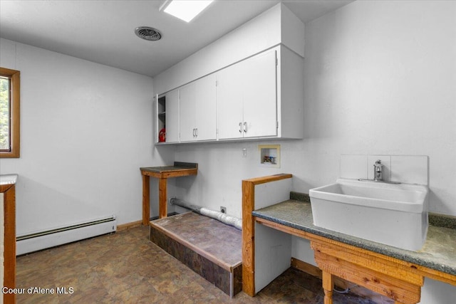 5239 E Dodd Rd, Hayden, ID 83835 - washroom featuring a baseboard heating unit, washer hookup, and cabinet space