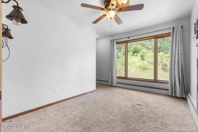 5239 E Dodd Rd, Hayden, ID 83835 - carpeted empty room with baseboards, ceiling fan, and a baseboard heating unit