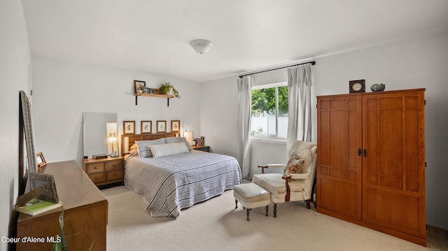 bedroom with light colored carpet