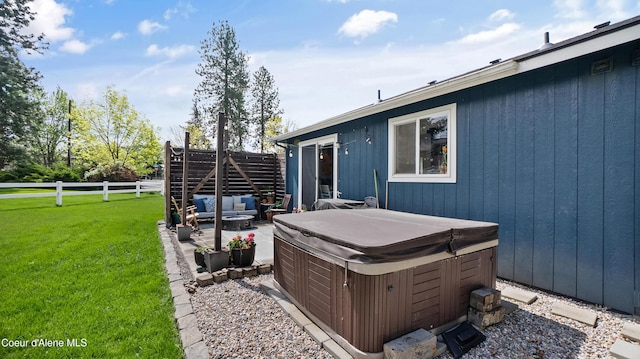 view of yard with a hot tub, a patio area, and an outdoor hangout area