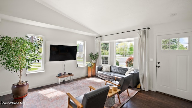 living room with lofted ceiling, wood finished floors, and baseboards