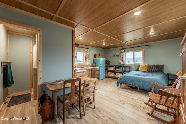 bedroom with wood ceiling, freestanding refrigerator, light wood finished floors, and recessed lighting