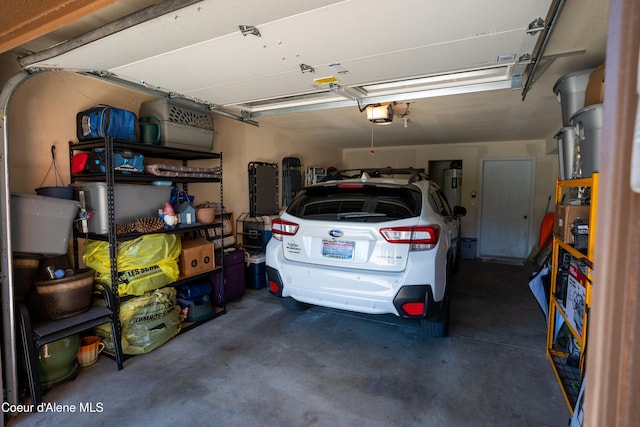 1 Elsie Peak Ct Unit B1 Bldg B, Pinehurst, ID 83850 - garage featuring a garage door opener and electric water heater