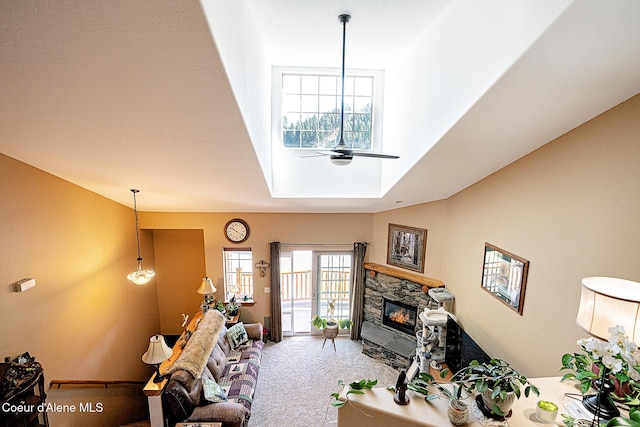 1 Elsie Peak Ct Unit B1 Bldg B, Pinehurst, ID 83850 - living area featuring a fireplace, a ceiling fan, carpet floors, and a towering ceiling