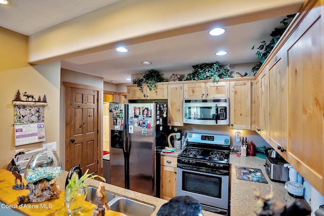 1 Elsie Peak Ct Unit B1 Bldg B, Pinehurst, ID 83850 - kitchen featuring appliances with stainless steel finishes, light brown cabinetry, recessed lighting, a sink, and light stone counters