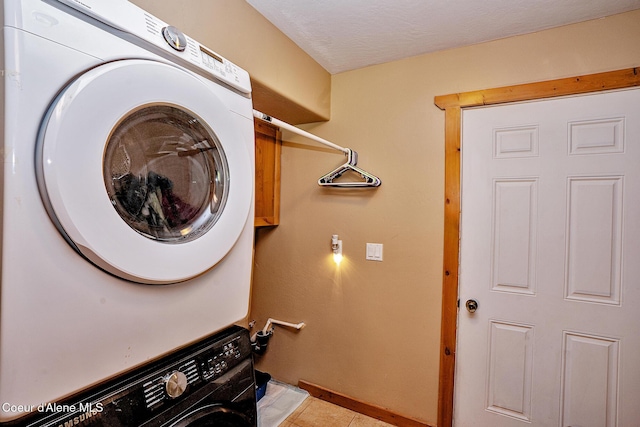 1 Elsie Peak Ct Unit B1 Bldg B, Pinehurst, ID 83850 - washroom featuring stacked washing machine and dryer and baseboards