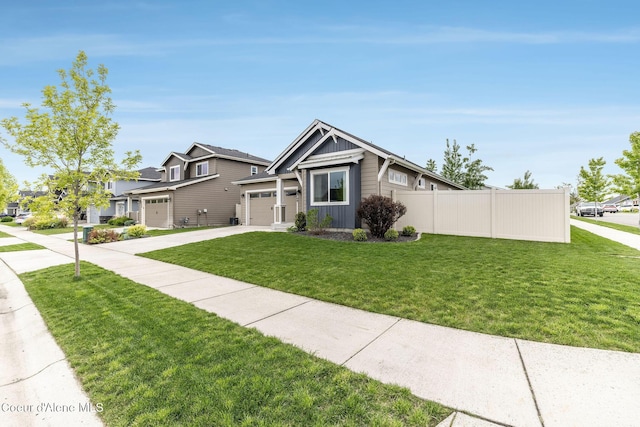 1769 N Chetco Dr, Post Falls, ID 83854 - view of front facade with driveway, board and batten siding, and an attached garage
