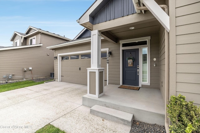 1769 N Chetco Dr, Post Falls, ID 83854 - doorway to property with driveway, board and batten siding, and an attached garage
