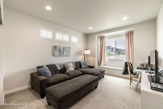 1769 N Chetco Dr, Post Falls, ID 83854 - living room with light colored carpet, healthy amount of natural light, recessed lighting, baseboards, and an office area