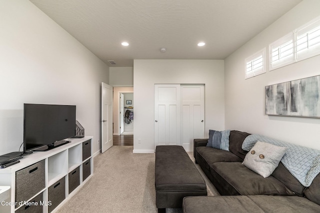 1769 N Chetco Dr, Post Falls, ID 83854 - living room featuring light carpet, recessed lighting, and baseboards
