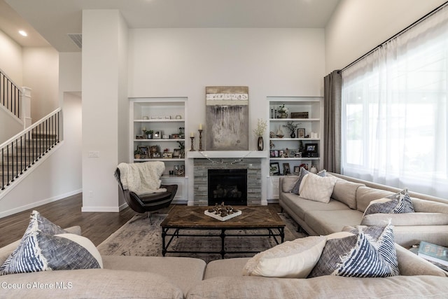 1769 N Chetco Dr, Post Falls, ID 83854 - living area with stairway, wood finished floors, a towering ceiling, recessed lighting, and baseboards
