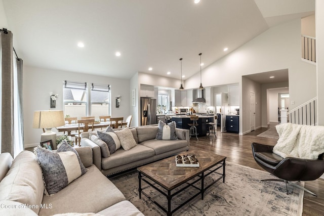 1769 N Chetco Dr, Post Falls, ID 83854 - living area featuring dark wood-style floors, recessed lighting, stairs, baseboards, and high vaulted ceiling