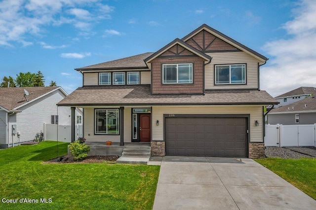 3316 N Van Winkle St, Post Falls, ID 83854 - craftsman inspired home featuring an attached garage, concrete driveway, a gate, a porch, and roof with shingles