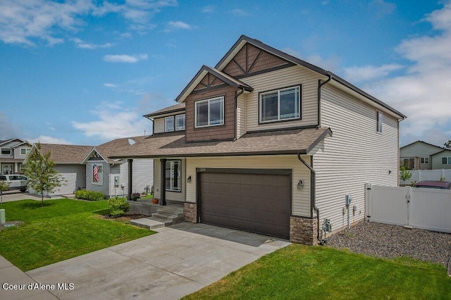 3316 N Van Winkle St, Post Falls, ID 83854 - craftsman-style house with an attached garage, driveway, stone siding, and a shingled roof