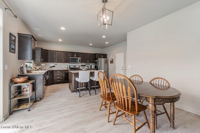 3316 N Van Winkle St, Post Falls, ID 83854 - dining area with light wood-type flooring, recessed lighting, a chandelier, and baseboards