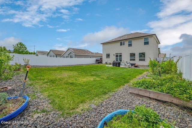 3316 N Van Winkle St, Post Falls, ID 83854 - rear view of house with a garden