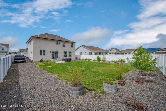 3316 N Van Winkle St, Post Falls, ID 83854 - rear view of house featuring a patio