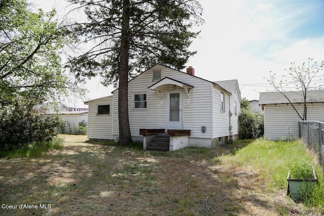 2224 N Park Rd, Spokane Valley, WA 99212 - rear view of property featuring a chimney and fence