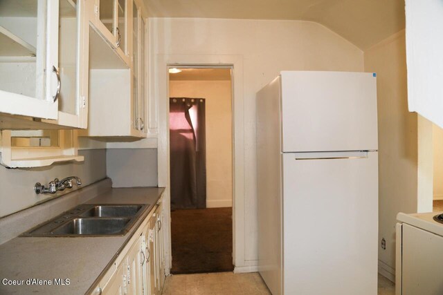 2224 N Park Rd, Spokane Valley, WA 99212 - kitchen with freestanding refrigerator, a sink, range, and lofted ceiling