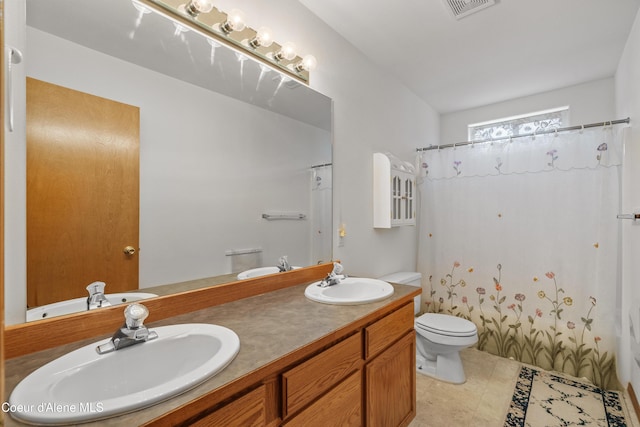 full bath with toilet, double vanity, and a shower with curtain