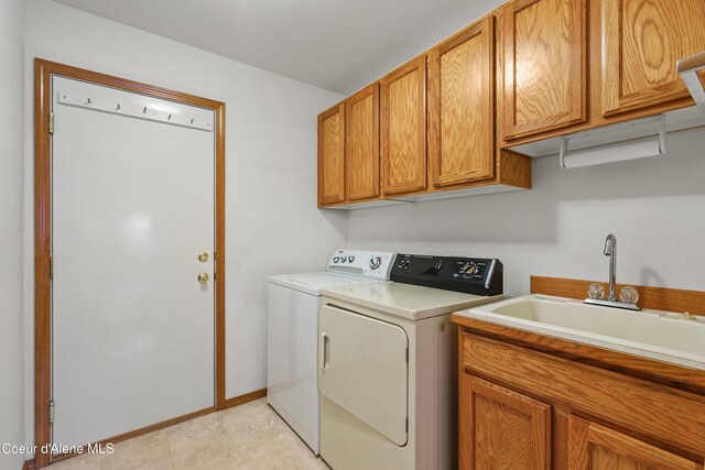 laundry area with cabinet space and separate washer and dryer