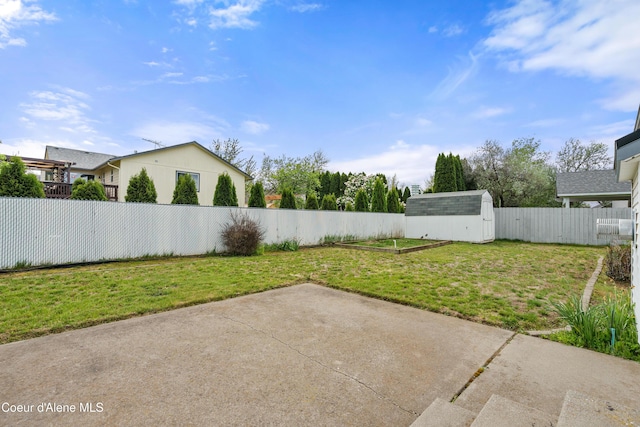 view of yard with a shed, a patio, and an outdoor structure