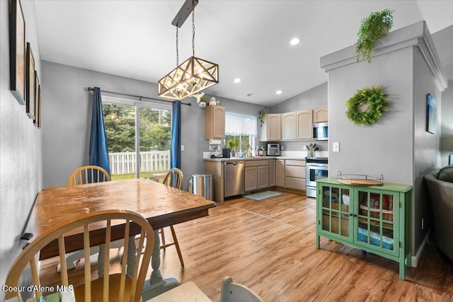 1135 W Wishkah Ave, Post Falls, ID 83854 - dining room featuring light wood-style floors, a chandelier, lofted ceiling, and recessed lighting