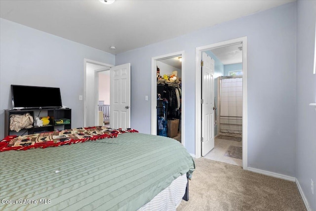 1135 W Wishkah Ave, Post Falls, ID 83854 - bedroom featuring a walk in closet, light colored carpet, ensuite bathroom, baseboards, and a closet
