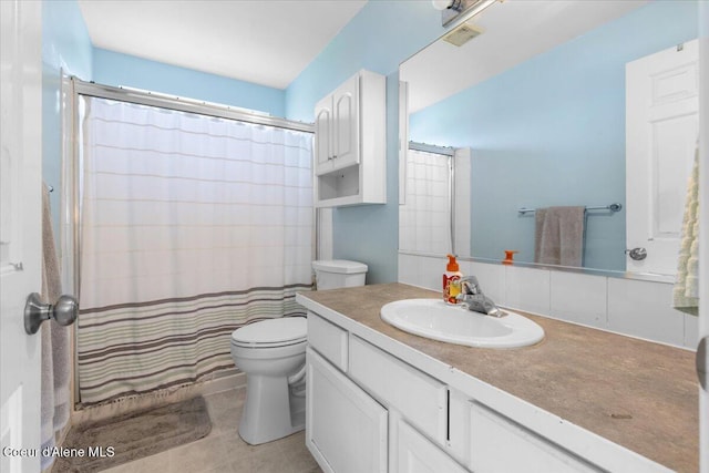 1135 W Wishkah Ave, Post Falls, ID 83854 - bathroom featuring toilet, vanity, and a shower with shower curtain