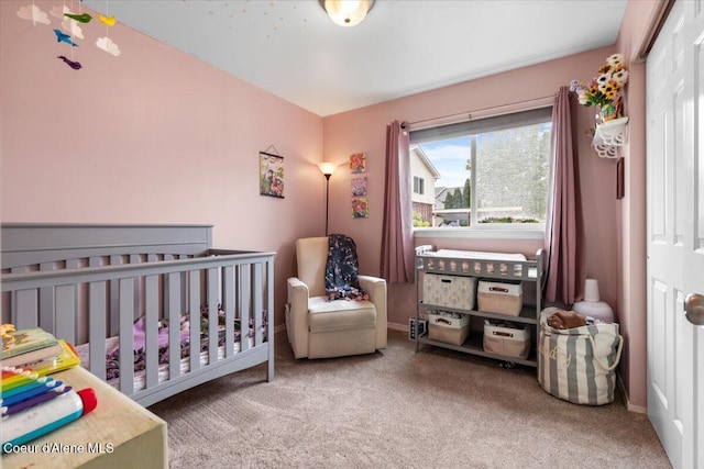 1135 W Wishkah Ave, Post Falls, ID 83854 - bedroom featuring carpet flooring, a closet, baseboards, and a nursery area