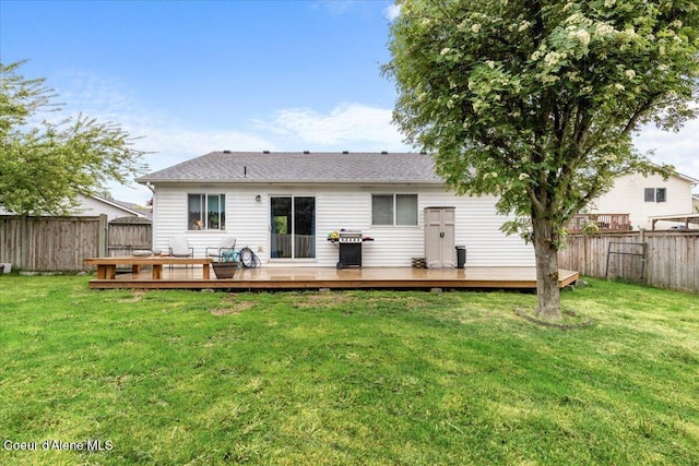 1135 W Wishkah Ave, Post Falls, ID 83854 - back of house featuring a wooden deck and roof with shingles